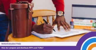 Hands of a person standing at a desk writing on documents