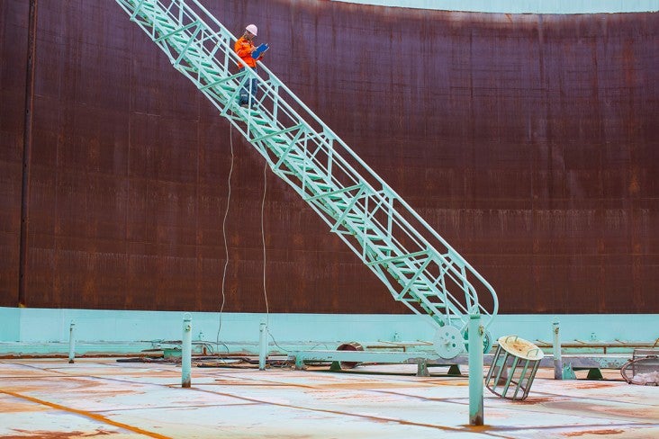 Person inspecting a storage silo