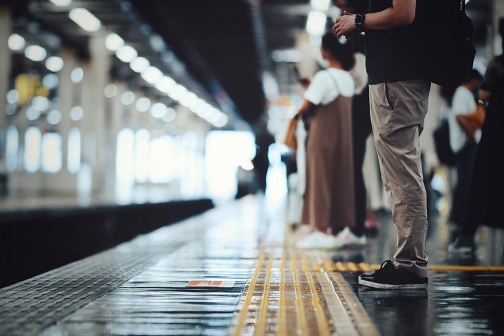 People waiting for a train to arrive