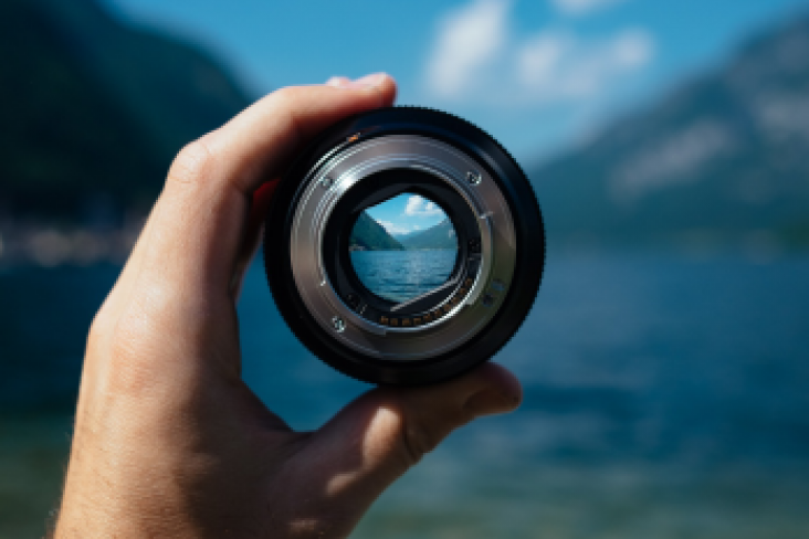 Lens and scenic background